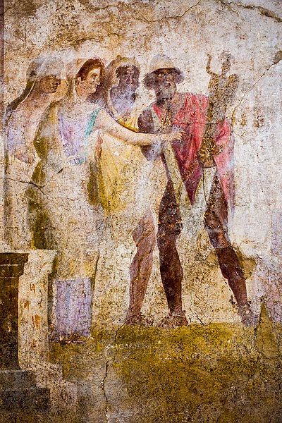 Odysseus (pileus hat) carrying off the palladion from Troy, with the help of Diomedes, against the resistance of Cassandra and other Trojans. Antique fresco from Pompeii.