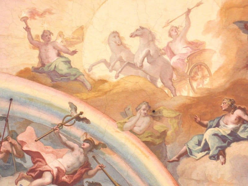 Helios in a chariot being drawn by two horses across the sky.