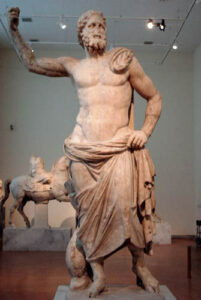 Majestic marble Poseidon statue with dolphin support from Milos