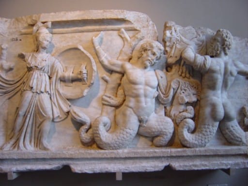 In the Gigantomachy from a 1st-century AD frieze in the agora of Aphrodisias, the Giants are depicted with scaly coils, like Typhon