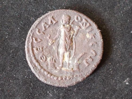 Figure of Cabeiros standing facing on a coin