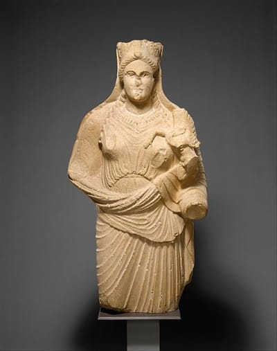 Limestone statue of Aphrodite holding winged Eros